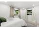 Cozy bedroom with natural light and simple, clean decor at 8721 N Whittier St, Tampa, FL 33617