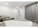 Bright bedroom featuring modern decor, a seating area, and plenty of natural light at 8721 N Whittier St, Tampa, FL 33617