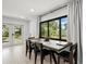 Elegant dining room with large windows and access to the backyard at 8721 N Whittier St, Tampa, FL 33617