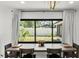 Bright dining room with neutral decor and a large window overlooking the backyard at 8721 N Whittier St, Tampa, FL 33617
