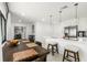 Open-concept dining area flowing into a modern kitchen with a large island at 8721 N Whittier St, Tampa, FL 33617