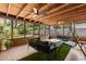 Inviting screened patio with ceiling fans, comfortable seating, and views of the backyard at 8721 N Whittier St, Tampa, FL 33617