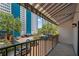 Balcony with awning overlooking a parking lot and buildings at 105 4Th Ne Ave # 220, St Petersburg, FL 33701