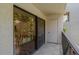 Tiled balcony providing access to the pool and view of the interior at 105 4Th Ne Ave # 220, St Petersburg, FL 33701