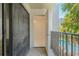 Balcony with tiled flooring, an open doorway, and railings overlooking the pool at 105 4Th Ne Ave # 220, St Petersburg, FL 33701