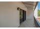 A large tiled balcony with black framed sliding glass doors, and a striped awning to provide shade at 105 4Th Ne Ave # 220, St Petersburg, FL 33701