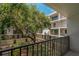 Balcony overlooking a courtyard with mature landscaping and views of multiple floors at 105 4Th Ne Ave # 220, St Petersburg, FL 33701
