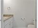 Bathroom featuring granite countertop vanity, toilet and modern fixtures at 105 4Th Ne Ave # 220, St Petersburg, FL 33701