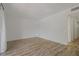 Empty bedroom with wood look floors, white walls, and closet at 105 4Th Ne Ave # 220, St Petersburg, FL 33701