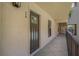 Exterior hallway featuring the unit's front door, number 220 at 105 4Th Ne Ave # 220, St Petersburg, FL 33701