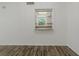 Bright living room featuring modern flooring and a pass-through view to the adjacent kitchen at 105 4Th Ne Ave # 220, St Petersburg, FL 33701