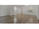 Spacious living room with hardwood floors and an open view to the kitchen at 105 4Th Ne Ave # 220, St Petersburg, FL 33701