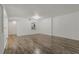 An empty living room with hardwood floors and a pass-through to the kitchen at 105 4Th Ne Ave # 220, St Petersburg, FL 33701