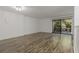A bright, modern living room with hardwood floors and balcony access at 105 4Th Ne Ave # 220, St Petersburg, FL 33701