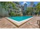 Triangular shaped community pool offering a refreshing retreat for residents at 105 4Th Ne Ave # 220, St Petersburg, FL 33701