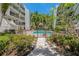 Community pool surrounded by lush landscaping and lounge chairs, providing a relaxing atmosphere at 105 4Th Ne Ave # 220, St Petersburg, FL 33701