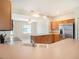 Bright, open kitchen with an island counter overlooks an eat-in breakfast nook area with plenty of room at 10534 Collar Dr, San Antonio, FL 33576