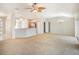 Bright and open living space featuring a combined living room and kitchen area with ample natural light at 10534 Collar Dr, San Antonio, FL 33576