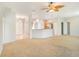 Bright and open living space featuring a combined living room and kitchen area with ample natural light at 10534 Collar Dr, San Antonio, FL 33576