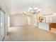 Bright and open living space featuring a combined living room and kitchen area with ample natural light at 10534 Collar Dr, San Antonio, FL 33576