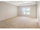 Large main bedroom has a tray ceiling and a big window that lets in lots of natural light at 10534 Collar Dr, San Antonio, FL 33576