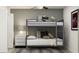 Contemporary bedroom featuring a bunk bed, stylish decor, and soft lighting at 12965 Shining Blue Nile Ln, Parrish, FL 34219