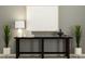 Stylish entryway featuring modern decor, a sleek console table, and elegant lighting at 12965 Shining Blue Nile Ln, Parrish, FL 34219