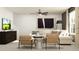 Comfortable living room with a sectional sofa, armchairs, and stylish decor at 12965 Shining Blue Nile Ln, Parrish, FL 34219