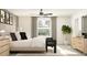 Bright main bedroom with large windows, neutral tones, and modern furniture at 12965 Shining Blue Nile Ln, Parrish, FL 34219