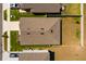 Aerial view of a house featuring a brown roof, green grass, and a fenced backyard at 1304 Tahitian Sunrise Dr, Plant City, FL 33565