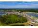 Beautiful aerial view of a community featuring homes, ponds and lush greenery at 1304 Tahitian Sunrise Dr, Plant City, FL 33565