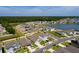 Aerial view of new home construction with lake views in a well-planned residential community at 1304 Tahitian Sunrise Dr, Plant City, FL 33565