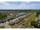 This aerial view highlights a Primary-planned community near a serene lake at 1304 Tahitian Sunrise Dr, Plant City, FL 33565