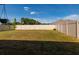 Expansive backyard with lush green grass and a sturdy privacy fence at 1304 Tahitian Sunrise Dr, Plant City, FL 33565