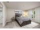 Inviting bedroom featuring a comfortable bed, bedside table, and calming decor for a serene atmosphere at 1304 Tahitian Sunrise Dr, Plant City, FL 33565