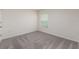 Empty bedroom featuring carpet, neutral walls and natural light at 1304 Tahitian Sunrise Dr, Plant City, FL 33565