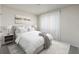 Serene bedroom with soft lighting, neutral decor, and a plush bed at 1304 Tahitian Sunrise Dr, Plant City, FL 33565