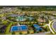 Aerial shot of the community pool, playground, basketball court, and other amenities at 1304 Tahitian Sunrise Dr, Plant City, FL 33565