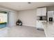 Bright dining area features a tile floor, sliding door to the yard, and access to the kitchen at 1304 Tahitian Sunrise Dr, Plant City, FL 33565