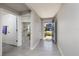 Open foyer with neutral walls and tile floor; view to living spaces and front door at 1304 Tahitian Sunrise Dr, Plant City, FL 33565