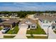 Charming single-Gathering home with manicured lawn, a two-car garage, and a welcoming front entrance at 1304 Tahitian Sunrise Dr, Plant City, FL 33565