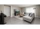 Comfortable living room with a couch, area rug, modern lighting, and entertainment center at 1304 Tahitian Sunrise Dr, Plant City, FL 33565