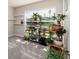 Bright office featuring plants, shelves and a large window providing ample natural light at 1304 Tahitian Sunrise Dr, Plant City, FL 33565