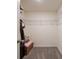 Functional walk-in closet with wire shelving, carpeted flooring and storage chest at 1304 Tahitian Sunrise Dr, Plant City, FL 33565