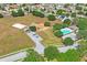 Aerial view of community amenities, including a pool, playground, sports court, and green space, enhancing the neighborhood appeal at 13131 Early Run Ln, Riverview, FL 33578