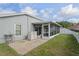 The backyard features a screened lanai and a white fence for privacy at 13131 Early Run Ln, Riverview, FL 33578