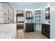 This bathroom features duel vanities, a glass enclosed shower and modern fixtures at 13131 Early Run Ln, Riverview, FL 33578