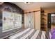 This Star Wars themed bedroom boasts laminate floors, modern lighting, and a barn-style closet door at 13131 Early Run Ln, Riverview, FL 33578