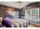 This Star Wars themed bedroom boasts laminate floors, modern lighting, and a large, bright window at 13131 Early Run Ln, Riverview, FL 33578
