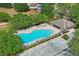 Aerial view of the community pool area with ample seating, a covered pavilion, and convenient parking at 13131 Early Run Ln, Riverview, FL 33578